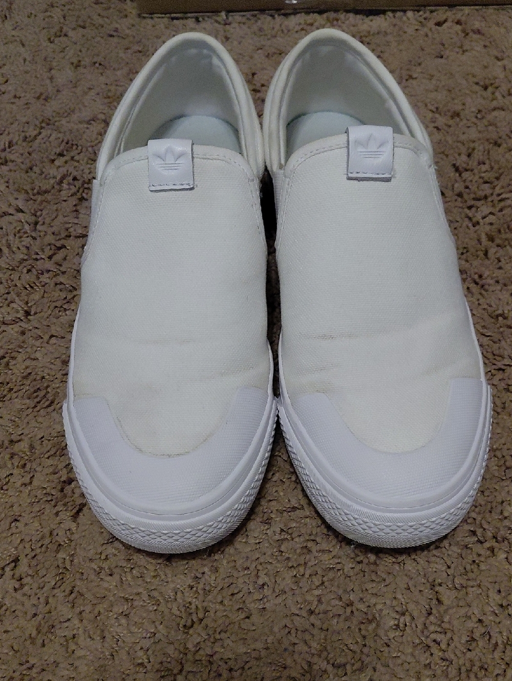 adidas Mens All-White Slip-On Canvas Shoes
